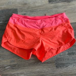 SUPER CUTE Lululemon fluorescent orange shorts. Size 6. NWOT